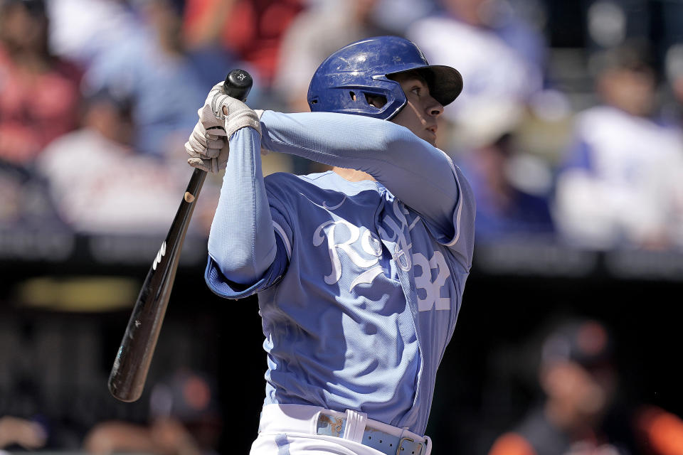 Kansas City Royals' Nick Pratto hits a sacrifice double play to score a run during the first inning of a baseball game against the Detroit Tigers Sunday, Sept. 11, 2022, in Kansas City, Mo. (AP Photo/Charlie Riedel)