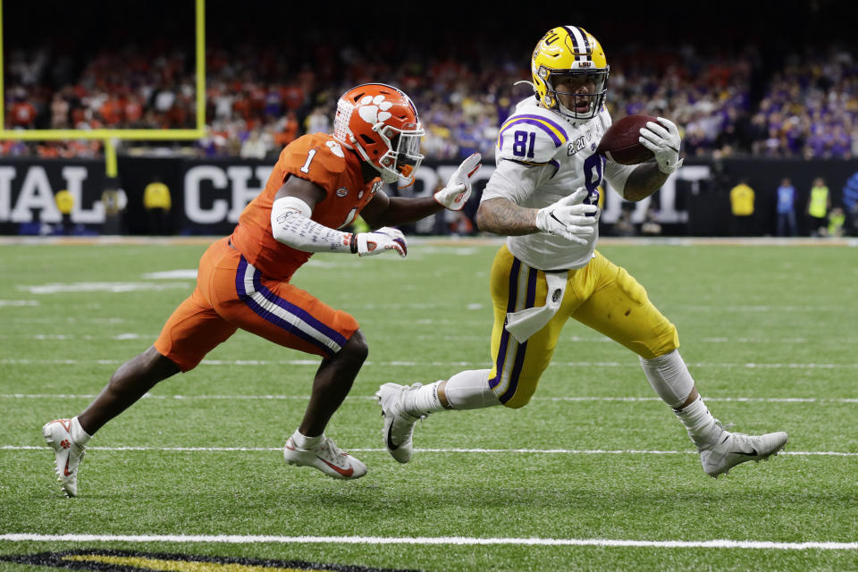 LSU tight end Thaddeus Moss, right, declared for the NFL Draft on Friday. (AP/Sue Ogrocki)