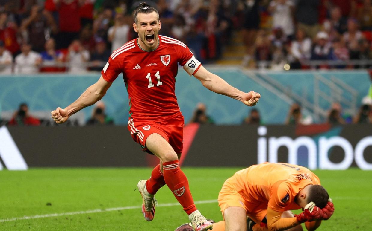 Soccer Football - FIFA World Cup Qatar 2022 - Group B - United States v Wales - Ahmad Bin Ali Stadium, Al Rayyan, Qatar - November 21, 2022 Wales' Gareth Bale celebrates scoring their first goal - REUTERS/Hannah Mcka