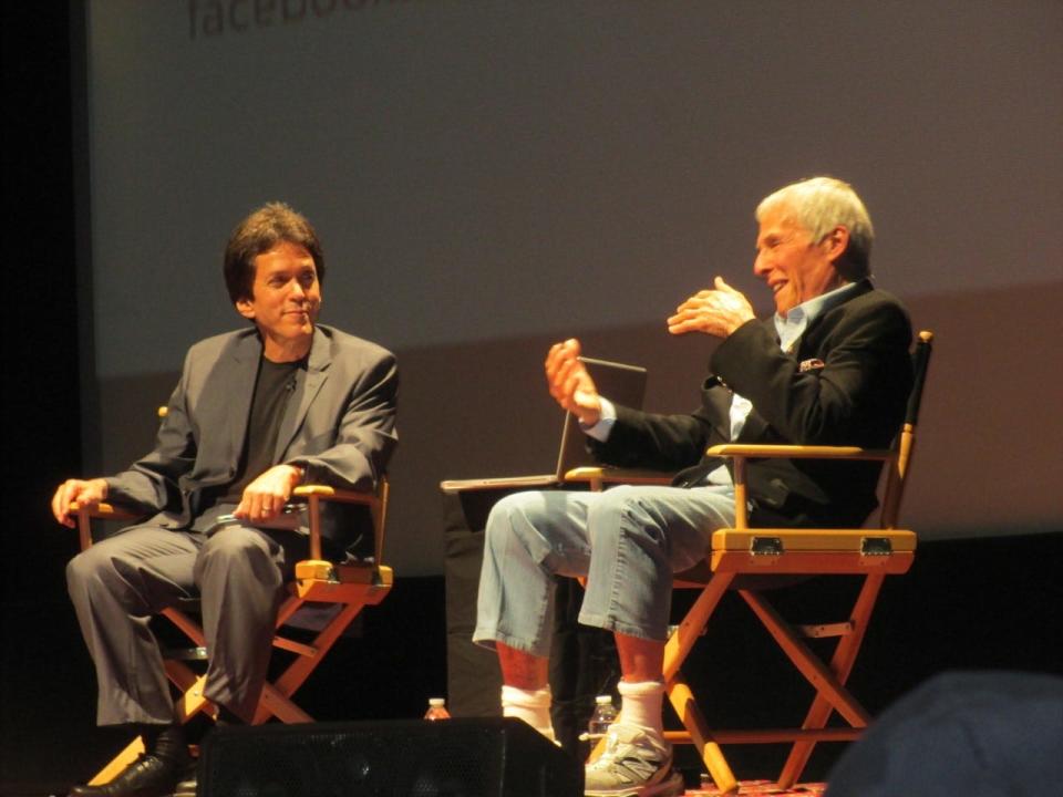 Mitch Albom and Burt Bacharach share the stage during an event in Los Angeles in 2013.