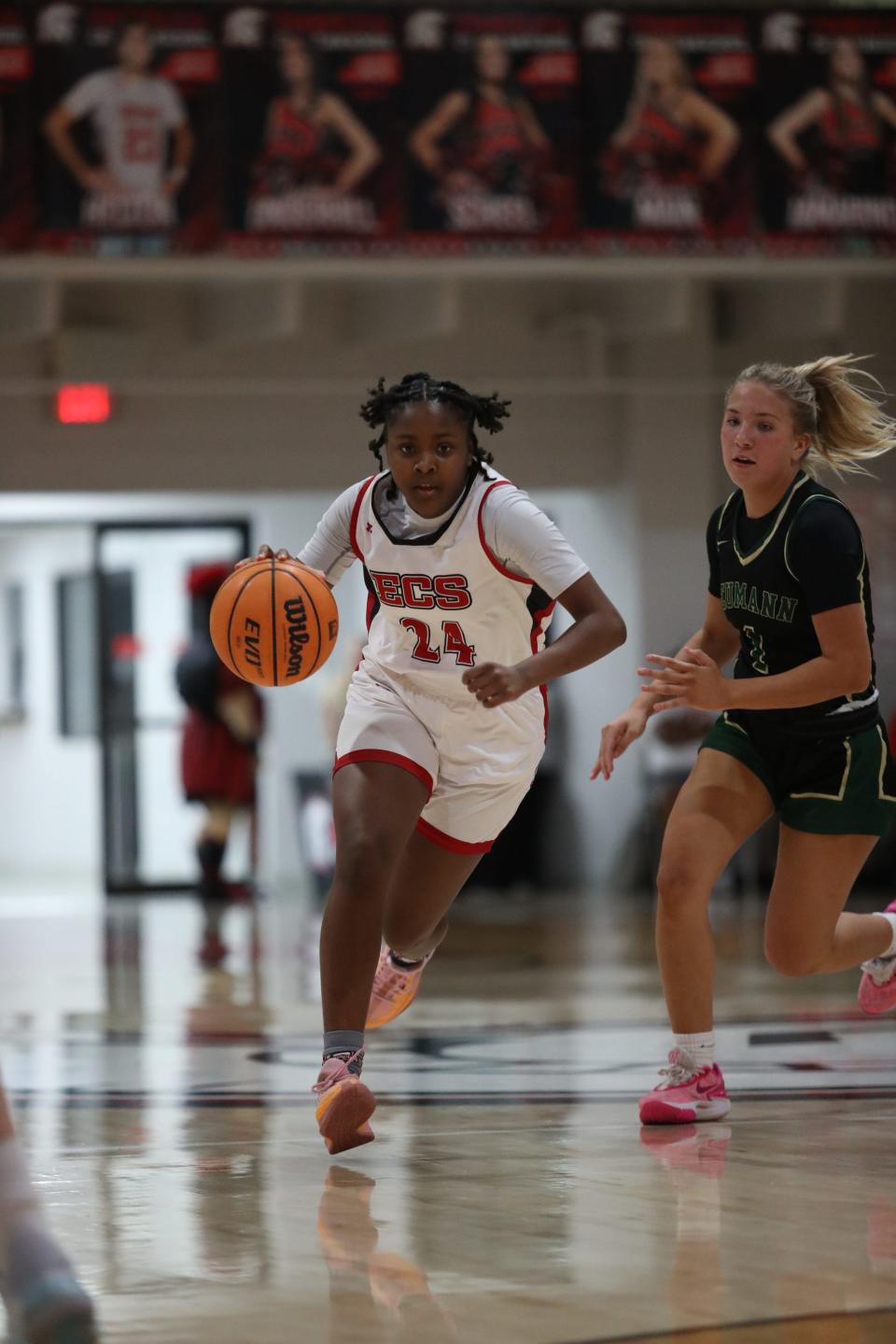 Kellisia Grant drives the ball for ECS against St. John Neumann in the Region 2A-3 girls basketball final on Thursday, Feb. 22, 2024, in Fort Myers.