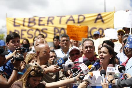 Venezuela's opposition leader Maria Corina Machado (R) speaks during a gathering in support of arrested Caracas metropolitan mayor Antonio Ledezma in Caracas February 20, 2015. REUTERS/Carlos Garcia Rawlins