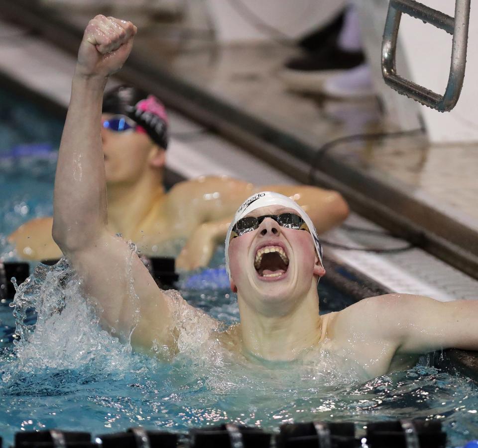 Cincinnati St. Xavier's Thackston McMullan celebrates after winning the boys 500 yard freestyle with a time of 4:26.58 during the 2022 Division I State Swimming Championship.