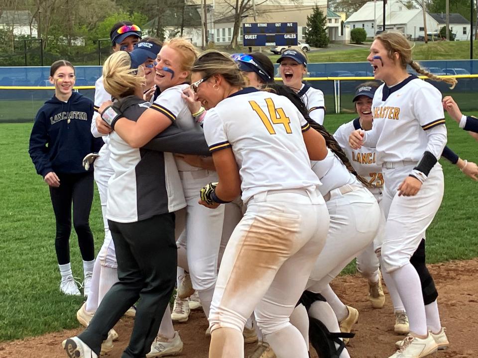 Lancaster junior pitcher Reese Poston is all smiles as she hugs coach Allie Kinniard after the Lady Gales knocked off state-ranked Teays Valley 8-0 on Tuesday, April 25, 2023.