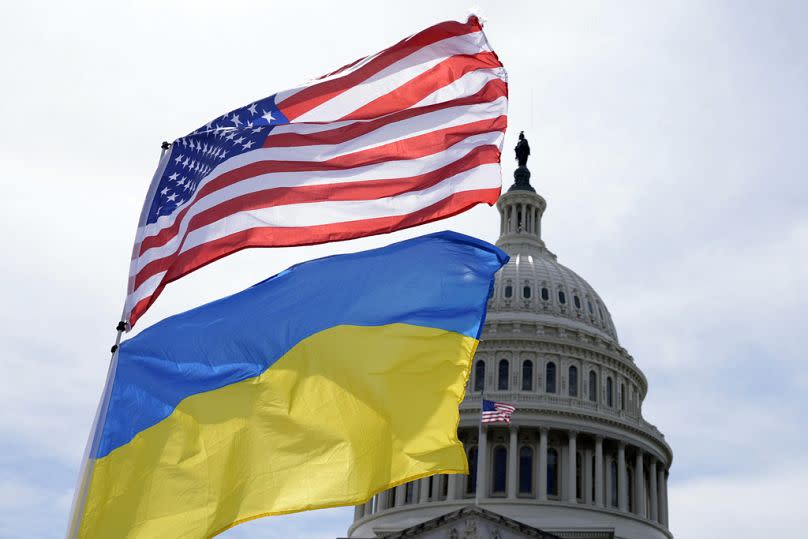 The American and Ukrainian flags wave in the wind outside of the Capitol on Tuesday, April 23, 2024, in Washington.