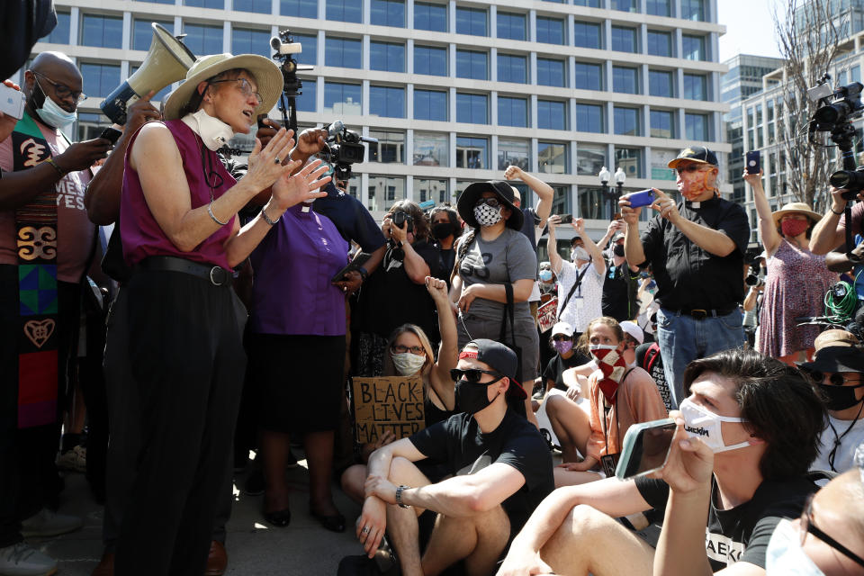 The Rev. Mariann Budde, bishop of the Episcopal Diocese of Washington, speaks Wednesday, June 3, 2020, down the block from St. John's Church, that is across Lafayette Park from the White House in Washington. (AP Photo/Alex Brandon)