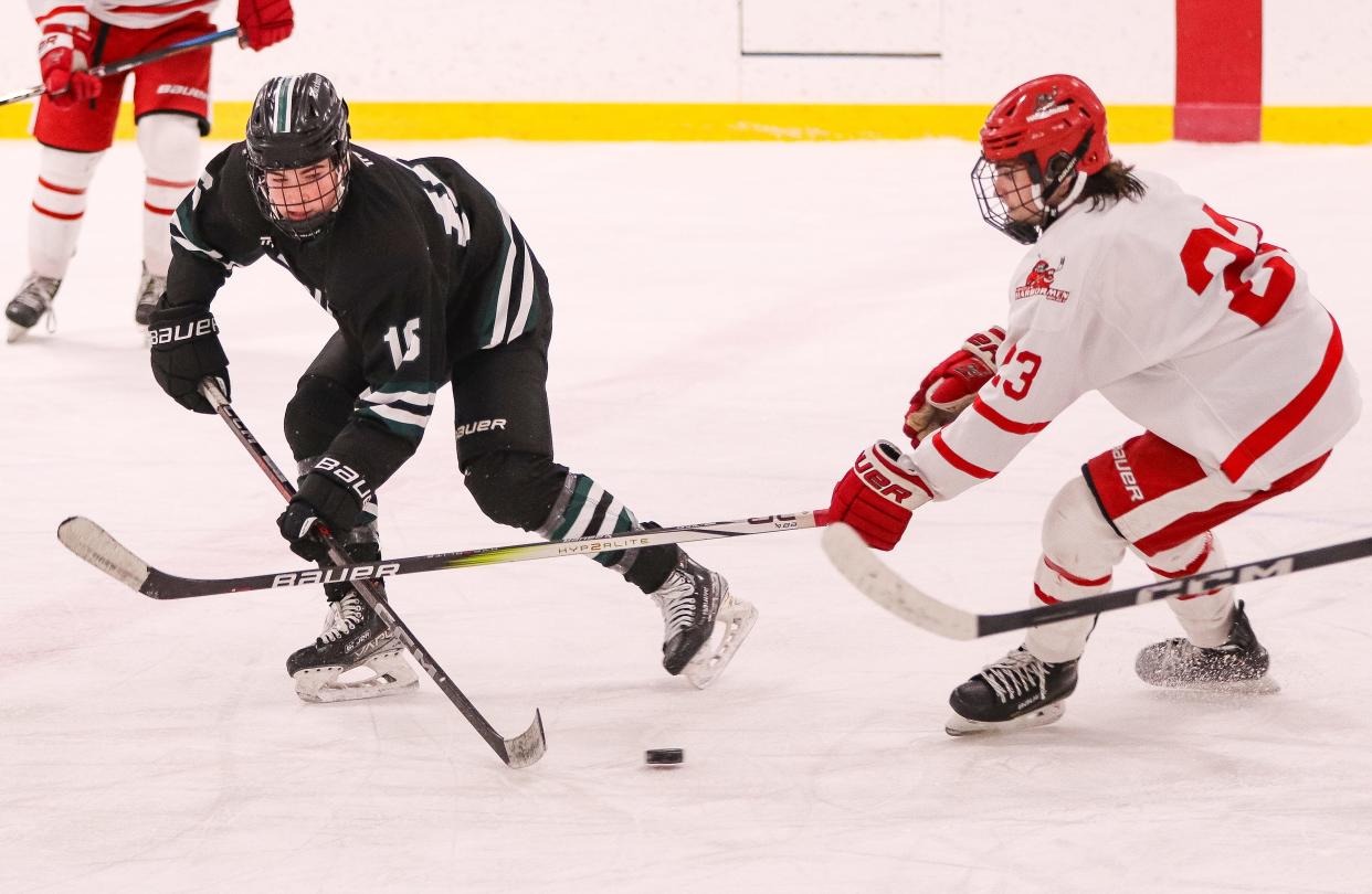 Hingham's Mason Lemieux battles Duxbury's Michael Hussey during a game at Pilgrim Skating Arena in Hingham on Monday, January 29, 2024.