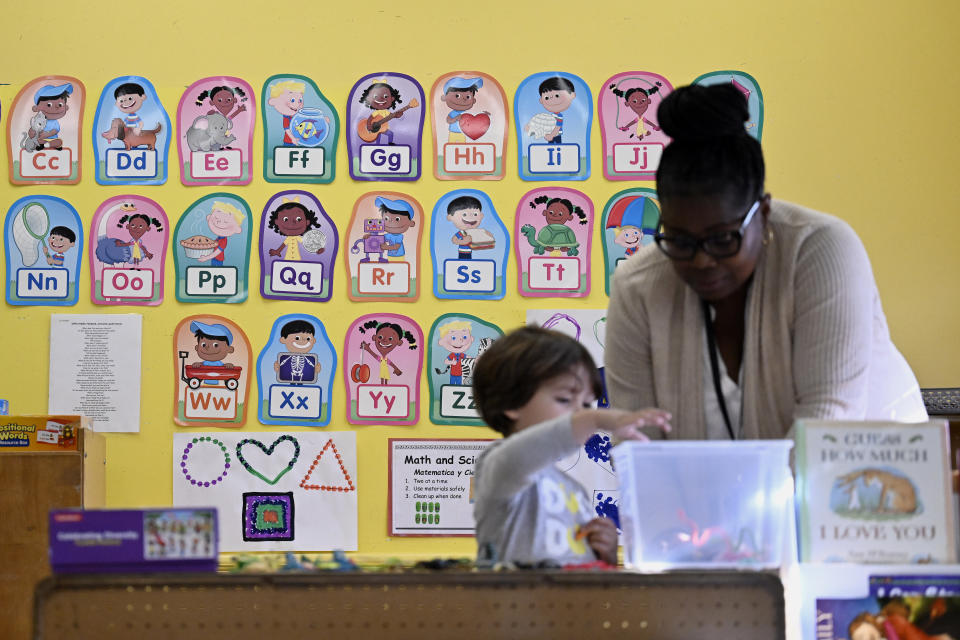 Alliance for Community Empowerment, Director of Early Learning Tanya Lloyd, right, interacts with a child in the Head Start program, Thursday, Sept. 28, 2023, in Bridgeport, Conn. Head Start programs serving more than 10,000 disadvantaged children would immediately lose federal funding if there is a federal shutdown, although they might be able to stave off immediate closure if it doesn't last long.(AP Photo/Jessica Hill)