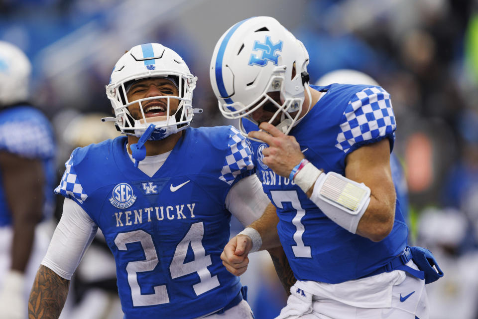Kentucky running back Chris Rodriguez Jr. (24) celebrates after scoring a touchdown with Kentucky quarterback Will Levis (7) against Vanderbilt during the second half of an NCAA college football game in Lexington, Ky., Saturday, Nov. 12, 2022. (AP Photo/Michael Clubb)