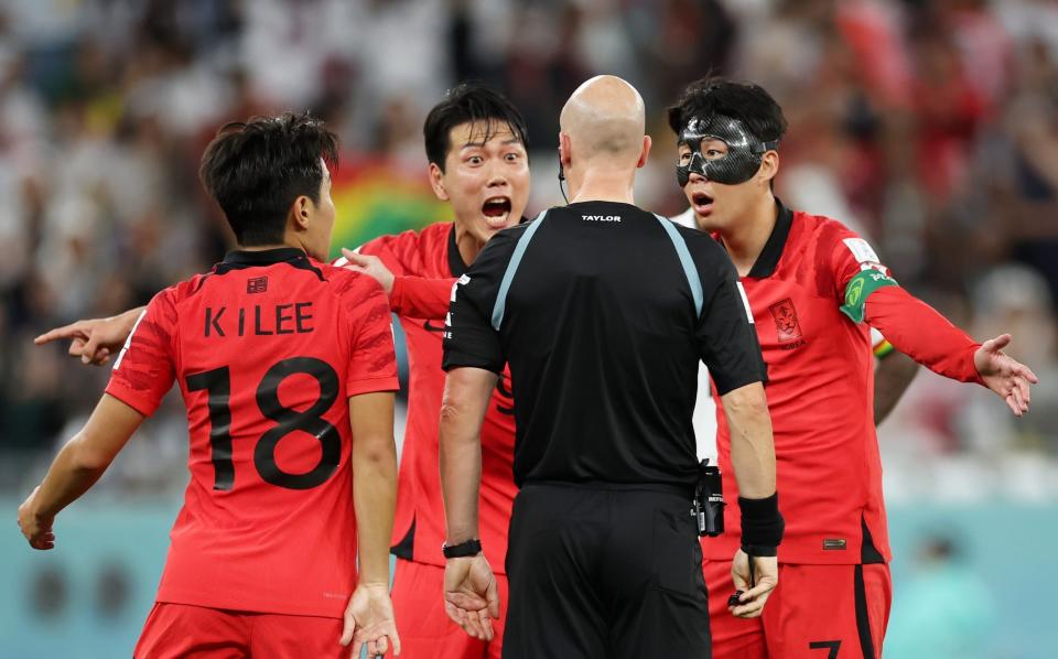  Heungmin Son of Korea Republic argues a call with referee Anthony Taylor - GETTY IMAGES/Alex Grimm