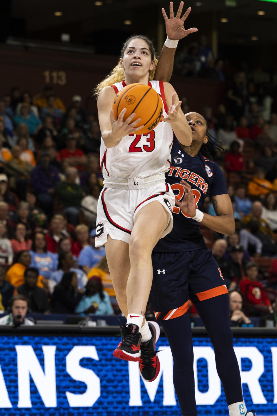 Georgia's Alisha Lewis (23) goes in for a layup against Auburn's Honesty Scott-Grayson (23) during the first half of an NCAA college basketball game during the Southeastern Conference women's tournament in Greenville, S.C., Thursday, March 2, 2023. (AP Photo/Mic Smith)