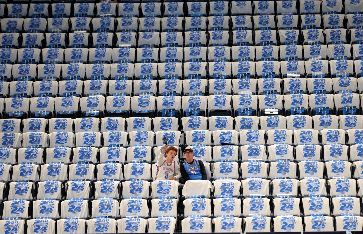 Thunder fans sit in stands among a sea of playoff T-shirts on Sunday night before Game 1 of a first-round series against the Pelicans at Paycom Center.