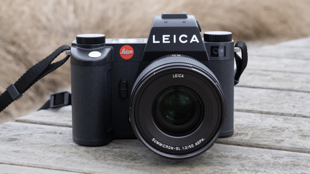  The Leica SL3 camera sat on a wooden bench. 