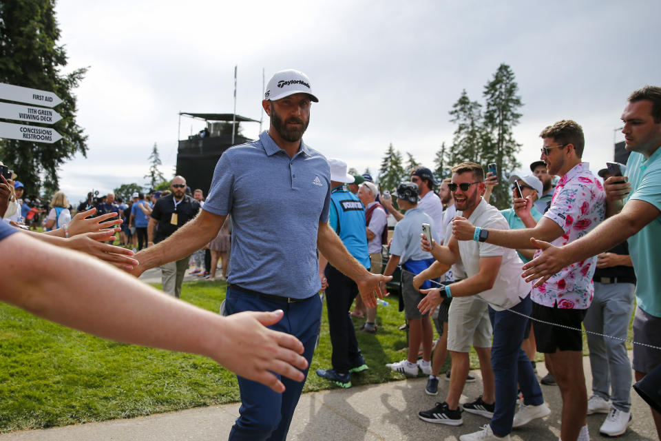 Seen here, Former World No.1 Dustin Johnson high-fives fans in Portland.