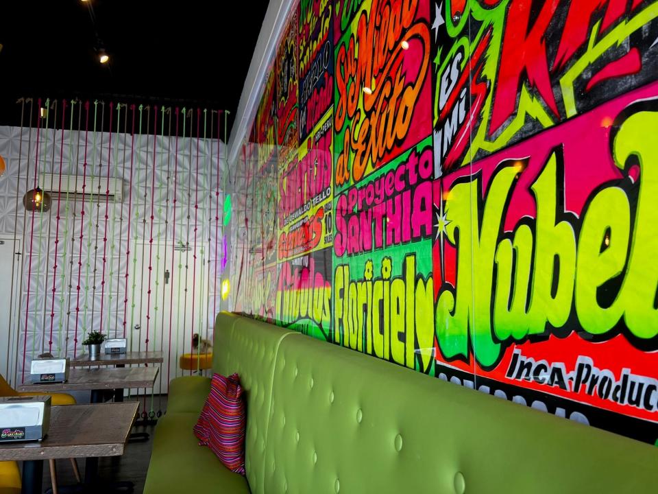 A long celery green banquette lines one wall of Panka Peruvian Chicken in the Drake neighborhood. Owner Mariela Maya hung a rope wall to create a little privacy on the way to the bathrooms.