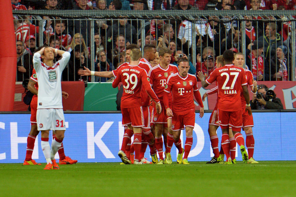 Bayern Munich's players celebrate after scoring during the German soccer cup, DFB Pokal, semifinal soccer match between FC Bayern Munich and FC Kaiserslautern in the Allianz Arena in Munich, Germany, on Wednesday, April 16. 2014. (AP Photo/Kerstin Joensson)