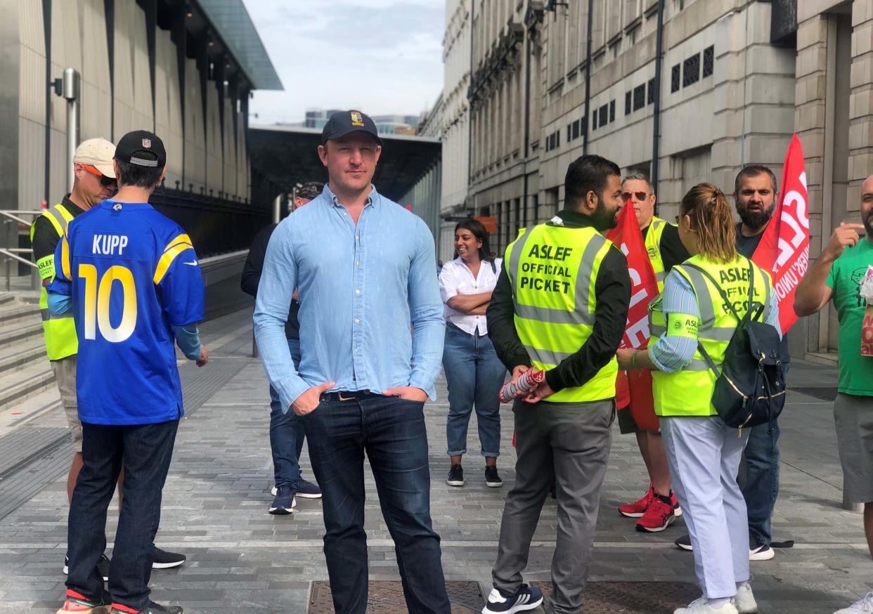 Sam Tarry, the former shadow transport minister, on the picket line outside Paddington train station (PA)