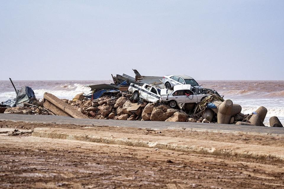 Devastating floods destroyed roads and swept up vehicles in Derna.