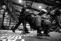 <p>Destyni Bynoe picks herself up after being knocked down to the canvas during a women’s match during the “Bronx Tough Turkey Tussle” at the New York Expo Center in the Bronx, New York, on Nov. 16, 2017. (Photo: Gordon Donovan/Yahoo News) </p>