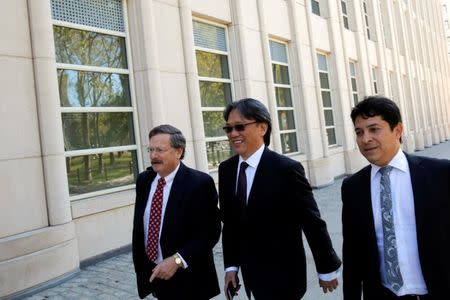 Former FIFA and CONCACAF executive committee member and former president of the Costa Rican soccer federation Eduardo Li (C) enters the Brooklyn Federal Court in Brooklyn, New York, U.S., October 7, 2016. REUTERS/Andrew Kelly