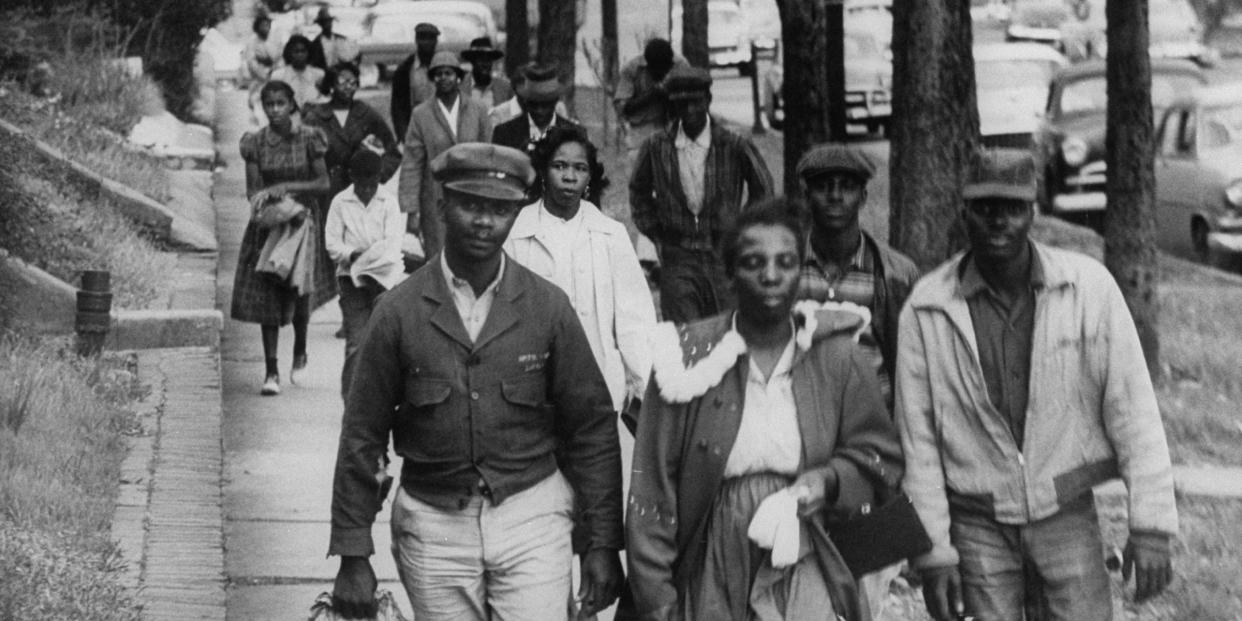 Montgomery Bus Boycotts: African Americans walk to work instead of riding the bus during the third month of an eventual 381 day bus boycott, Montgomery, Alabama, February 1956.