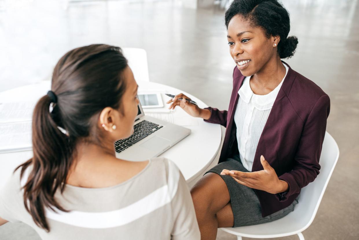 women in office speaking