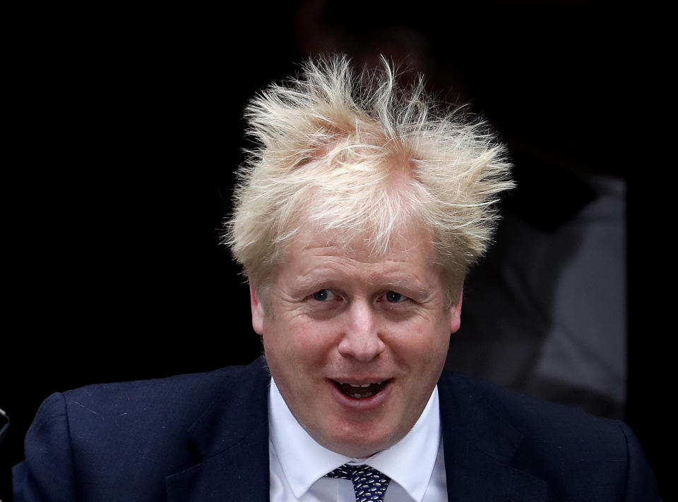 Britain's Prime Minister Boris Johnson leaves 10 Downing Street to attend the weekly Prime Ministers' Questions session, in parliament in London, Wednesday, Oct. 23, 2019. (AP Photo/Frank Augstein)