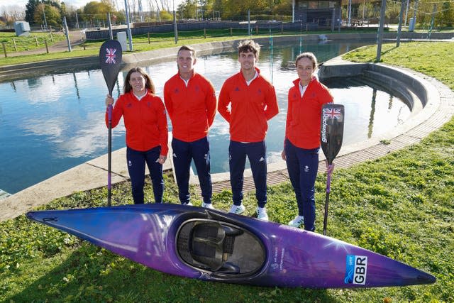 British medal hopefuls Kimberley Woods, Joe Clarke, Adam Burgess and Mallory Franklin pose with a canoe and oars