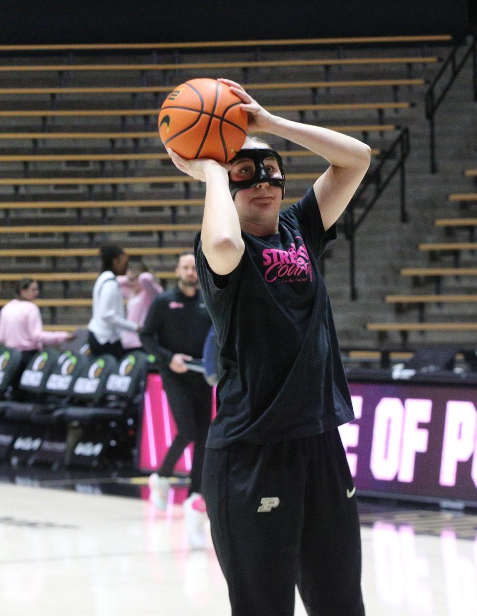 Purdue freshman Mary Ashley Stevenson warms up with a mask to protect her broken nose before playing against Illinois on Monday, Feb. 5, 2024.