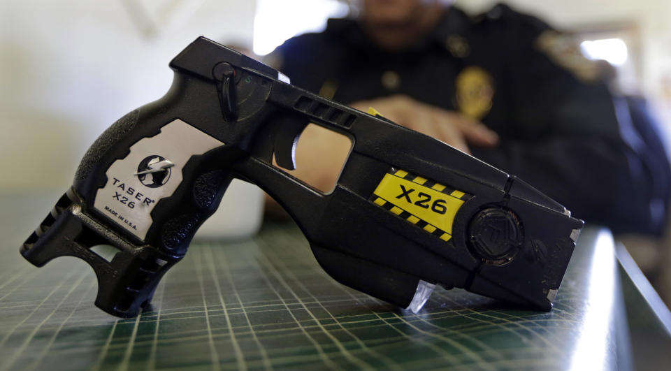 FILE - This Nov. 14, 2013, file photo, shows a Taser X26 on display. Shares in Axon Enterprises, the maker of Taser stun guns, have fallen more than 6 percent after the company admitted it had not replied to Securities and Exchange Commission inquiries due to “miscommunication issues.” In a filing with the SEC on Thursday, Oct. 19, 2017, Axon said it had just become aware of the inquiries from the agency and was working to resolve the matter. (AP Photo/Michael Conroy, File)