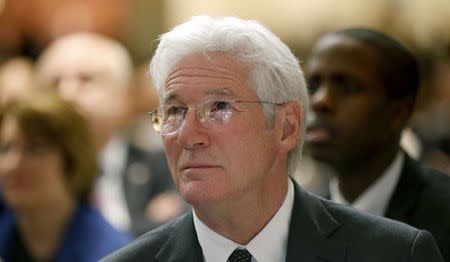 Actor Richard Gere attends the National Prayer Breakfast in Washington February 5, 2015. Gere is a practicing Tibetan Buddhist and active supporter of the Dalai Lama who was seated nearby. REUTERS/Kevin Lamarque