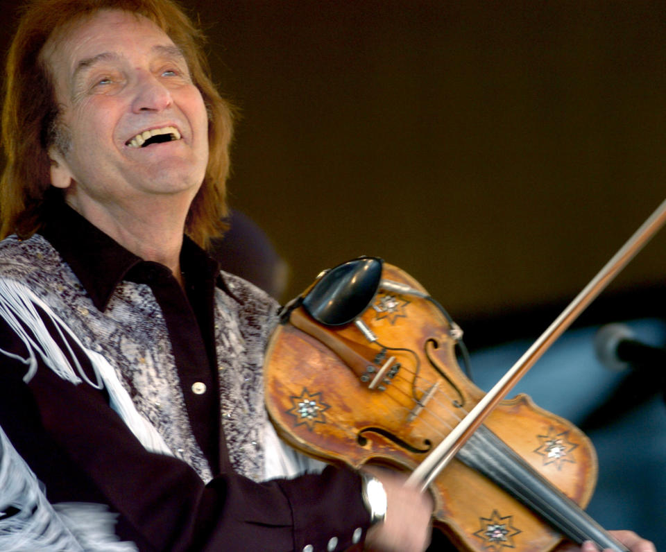 In this Saturday, Nov. 4, 2006 photo, Doug Kershaw performs on the first day of the 22nd Louisiana Swamp Festival at the Audubon Zoo in New Orleans. With his memoir out last fall, and upcoming performances at a rockabilly festival in Spain and the New Orleans Jazz and Heritage Festival, he's once again in the spotlight.(Rusty Costanza/The Times-Picayune/The New Orleans Advocate via AP)