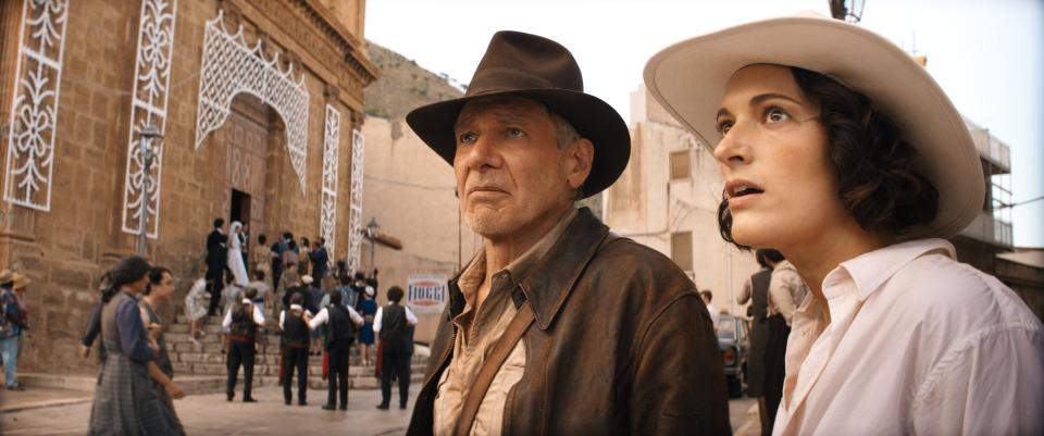 Indiana Jones (Harrison Ford) partners on a globetrotting mission with his estranged goddaughter Helena (Phoebe Waller-Bridge) in "Indiana Jones and the Dial of Destiny," Ford's last go-round in the iconic fedora.