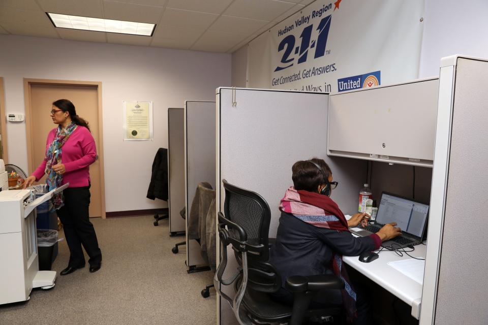 Lini Jacob, Chief Information and Referral Officer for United Way's Hudson Valley 211, uses the printer in the call center March 12, 2024 in White Plains.