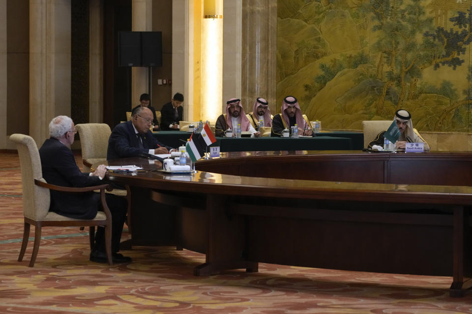 Saudi Arabia's Foreign Minister Faisal bin Farhan Al Saud, right, speaks during a round table meeting with Palestine Foreign Minister Riyad al-Maliki, left, and Egyptian Foreign Minister Sameh Shoukry, center, at the Diaoyutai state guesthouse in Beijing, Monday, Nov. 20, 2023. China's foreign minister welcomed five Arab and Islamic counterparts to Beijing on Monday, saying his country would work with "our brothers and sisters" in the Arab and Islamic world to try to end the fighting in Gaza as soon as possible. (AP Photo/Andy Wong)