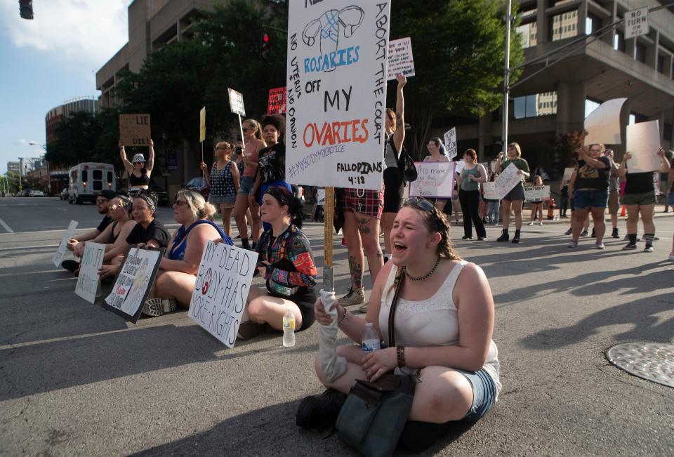 Ariana Kays chants with others in the middle of Jefferson Street as around 75 people took to the downtown streets on the Fourth of July afternoon to protest the recent SCOTUS ruling that triggered several states to outlaw abortion. Around 150 people showed up to the steps of the Hall of Justice to protest and chant. July 4, 2022