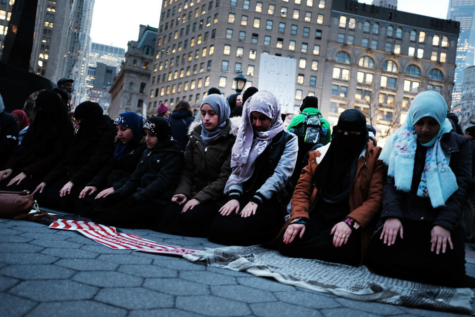 Muslim women pray before a protest in lower Manhattan against the polices of President Donald Trump on Feb. 1, 2017, in New York City.