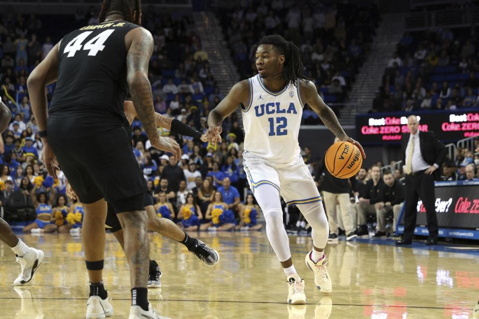 UCLA guard Sebastian Mack looks to pass during a win over Colorado on Feb. 15.