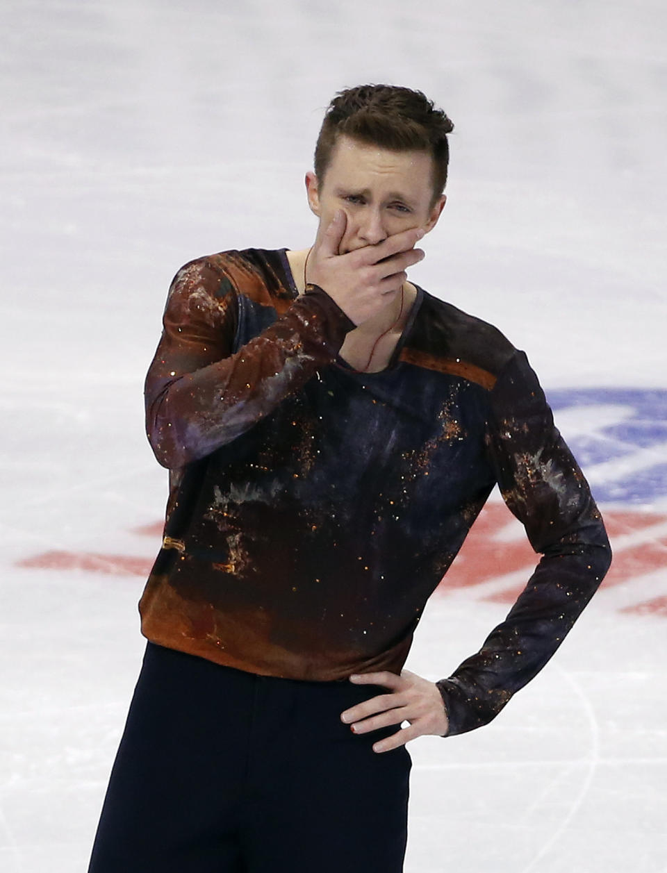 Jeremy Abbott reacts after skating in the men's free skate at the U.S. Figure Skating Championships in Boston, Sunday, Jan. 12, 2014. (AP Photo/Elise Amendola)