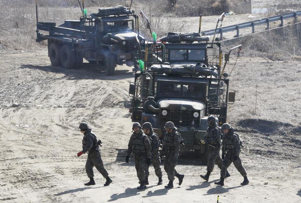 South Korean army soldiers prepare to conduct a river crossing operation near the Hantan river in Yeoncheon, near the border with North Korea, South Korea, Monday, March 6, 2017. North Korea on Monday fired four banned ballistic missiles that flew about 1,000 kilometers (620 miles), with three of them landing in Japan's exclusive economic zone, South Korean and Japanese officials said, in an apparent reaction to huge military drills by Washington and Seoul that Pyongyang insists are an invasion rehearsal. (AP Photo/Ahn Young-joon)