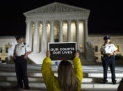 <p>A demonstrator protests in front of the Supreme Court as President Donald Trump announces Judge Brett Kavanaugh as his Supreme Court nominee in Washington, Monday, July 9, 2018. (Photo: Cliff Owen/AP) </p>