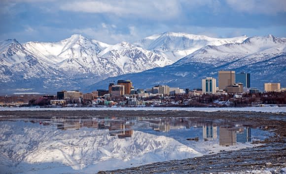 City of Anchorage, Alaska, framed by ocean in foreground and mountains in background