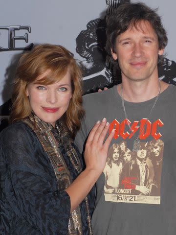 <p>Peter Bischoff/Getty</p> Milla Jovovich and Paul W.S. Anderson.