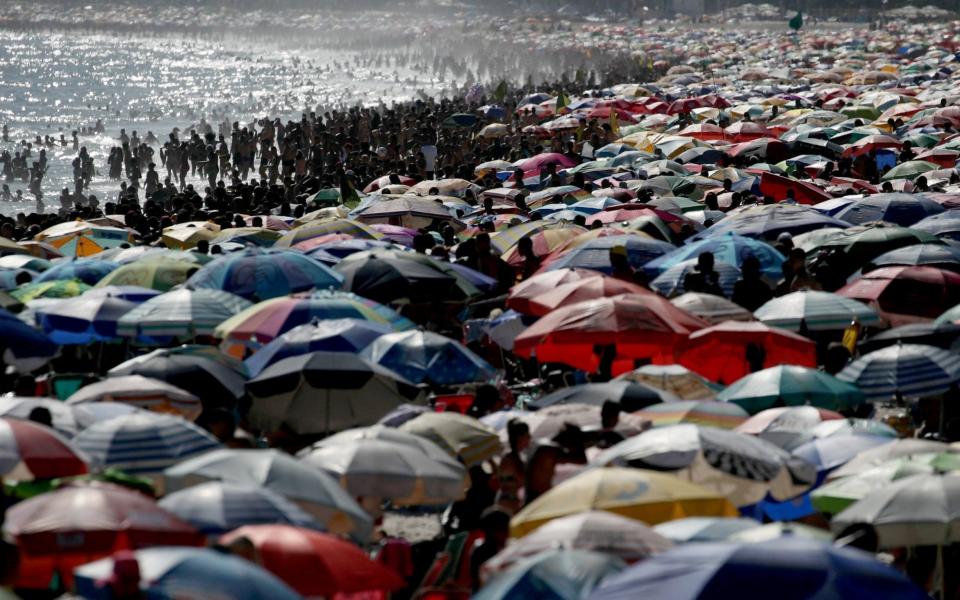 People enjoy Ipanema beach in spite of the coronavirus outbreak in Rio de Janeiro, Brazil - Ricardo Moraes/Reuters
