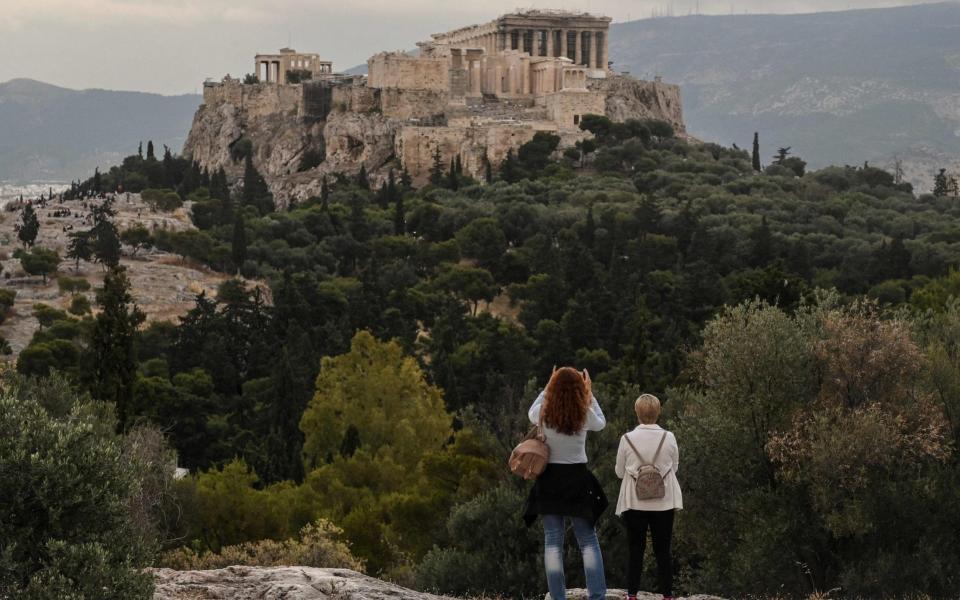 Tourist sites in Greece such as the Acropolis have recently reopened as the nation eases its lockdown -  LOUISA GOULIAMAKI/AFP