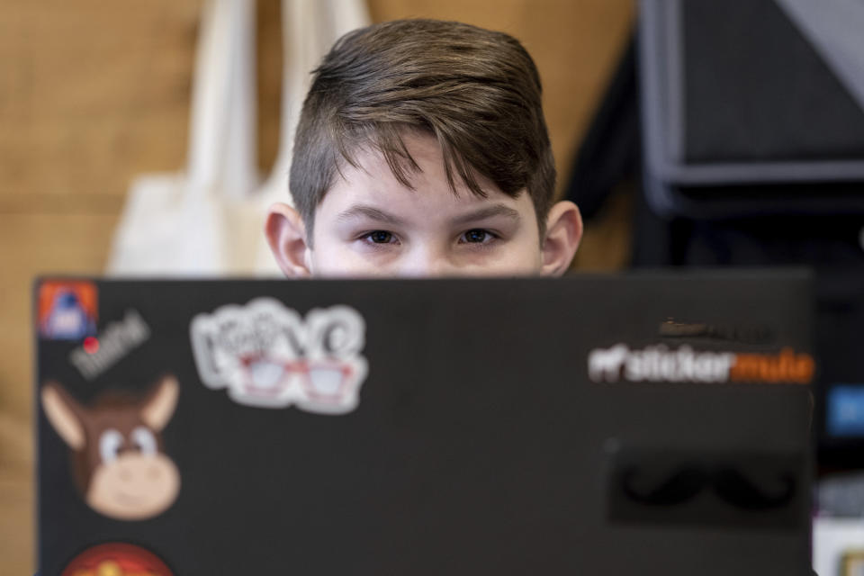 Tate Rivera is photographed at his home in Roswell, Ga., Friday, Feb. 12, 2021. Kelli Rivera is hoping a voucher bill passes that will help pay for her to move her son out of a public Cobb County school and into a private school. (AP Photo/Ben Gray)