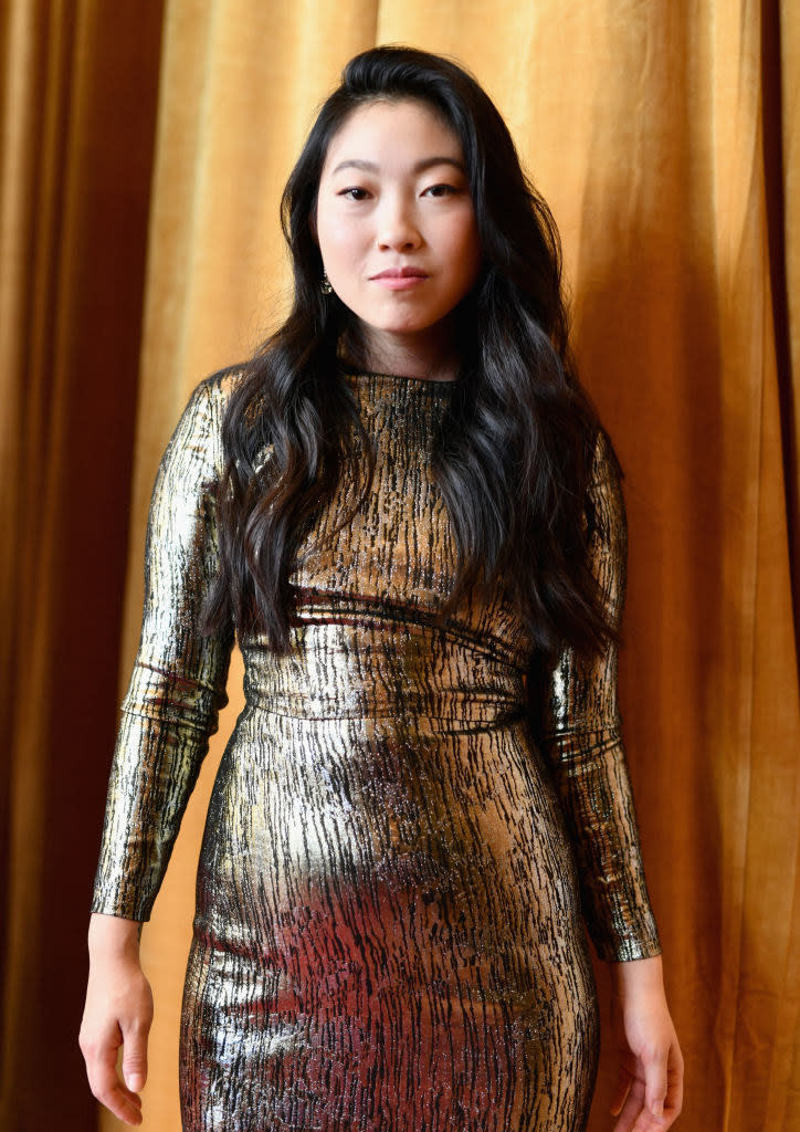 Awkwafina at the 2018 Hollywood Film Awards, she wears a long-sleeve bodycon dress