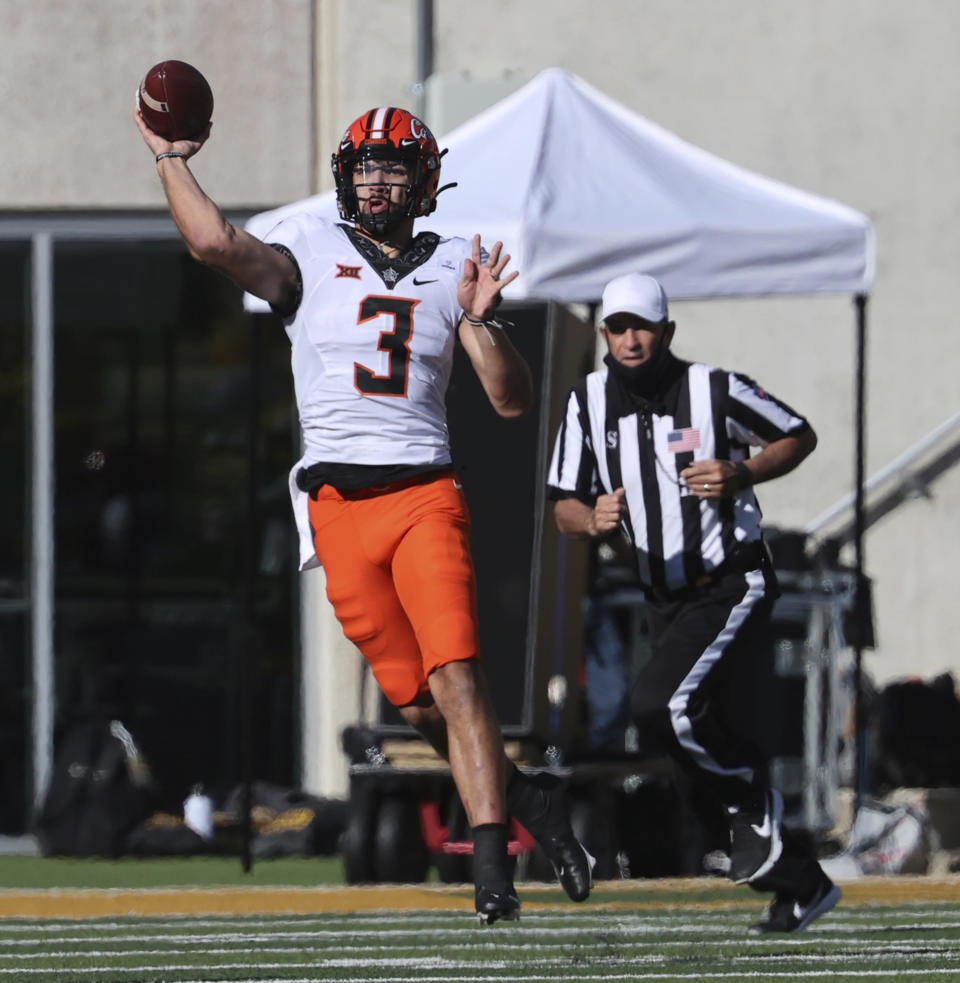 Oklahoma State quarterback Spencer Sanders throws downfield against Baylor in the first half of an NCAA college football game, Saturday, Dec. 12, 2020, in Waco, Texas. (Rod Aydelotte/Waco Tribune-Herald via AP)