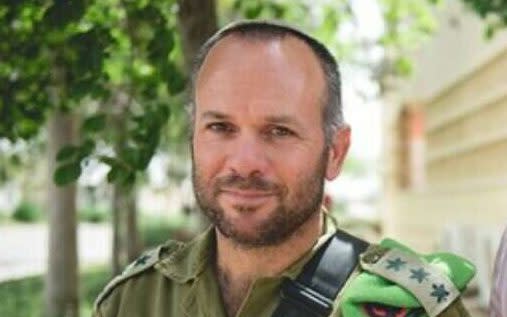 Colonel Nochi Mandel, pictured left with his father, called for the flow of aid into Gaza to be restricted