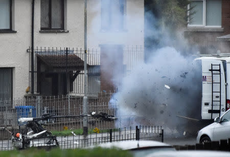 Debris emerges from a suspected vehicle as a controlled explosion takes place at the scene of a security alert in Londonderry, Northern Ireland, January 21, 2019. REUTERS/Clodagh Kilcoyne